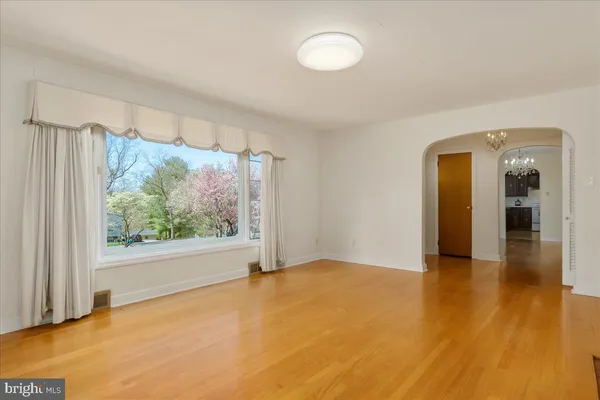 a view of a kitchen with a large window