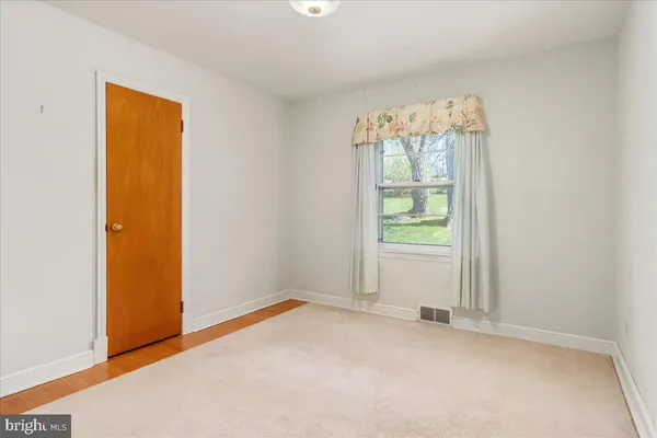 a bathroom with a sink a vanity and a bathtub