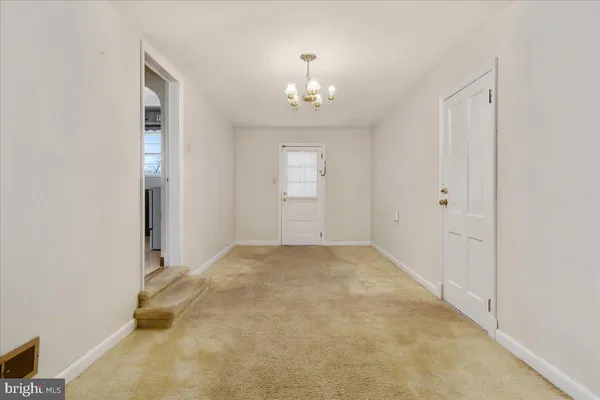 a view of a hallway with windows