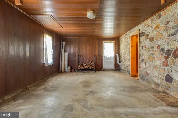 a view of an empty room with a fireplace