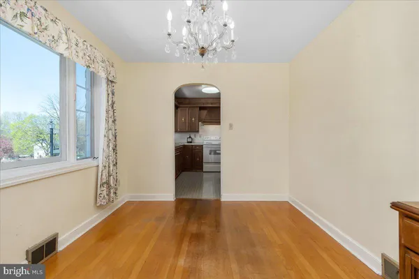 a view of a room with window and wooden floor