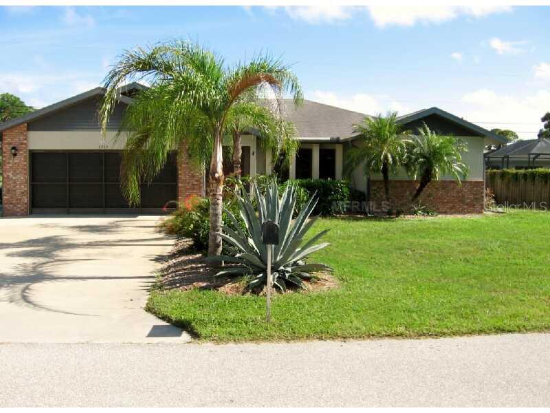 1315 Falcon Road Venice, FL 34293 - Photo 1 of 1 a view of a house with a yard and potted plants
