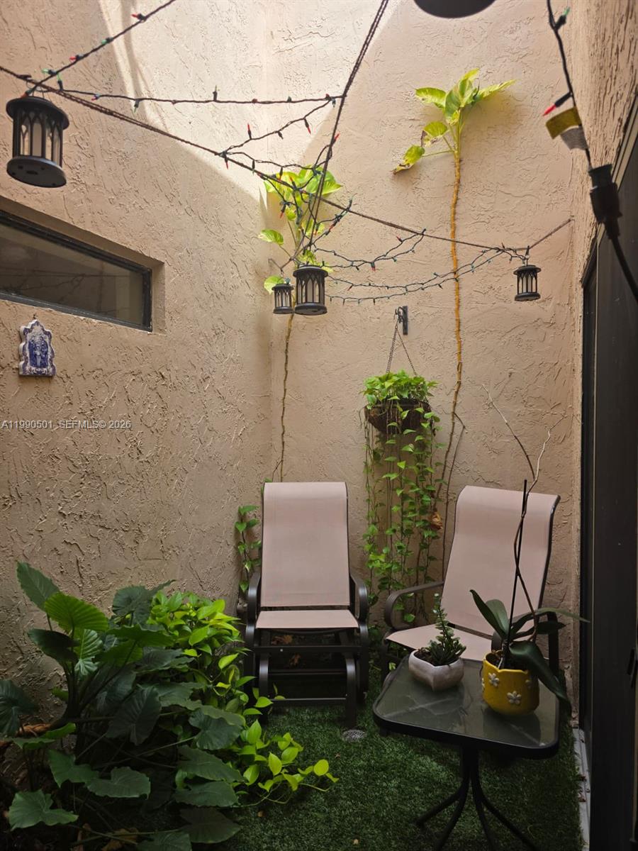 893 Southwest 120th Way Davie, FL 33325 - Photo 9 of 22 a view of a chairs in patio