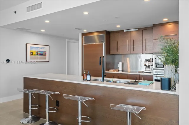 a kitchen with a table and chairs in it