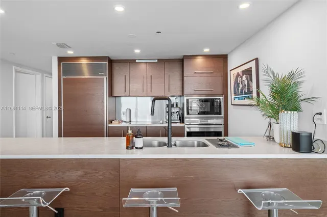 a living room with furniture and potted plant