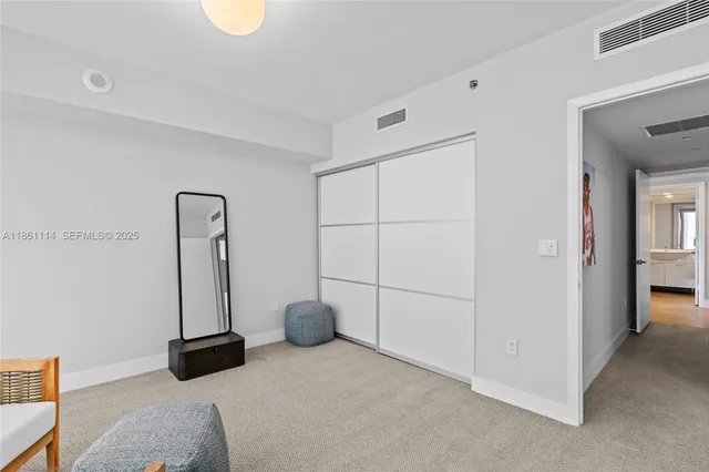 a bed room with a bed and a window