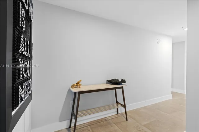 a bedroom with a bed and hallway