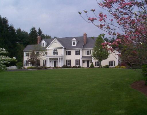 316 Ridgefield Road Wilton, CT 06897 - Photo 1 of 1 a front view of a house with a garden