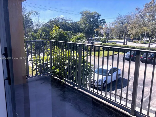 a kitchen with a sink a stove and cabinets