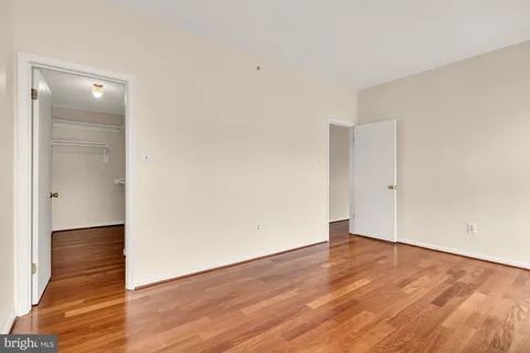 an empty room with wooden floor