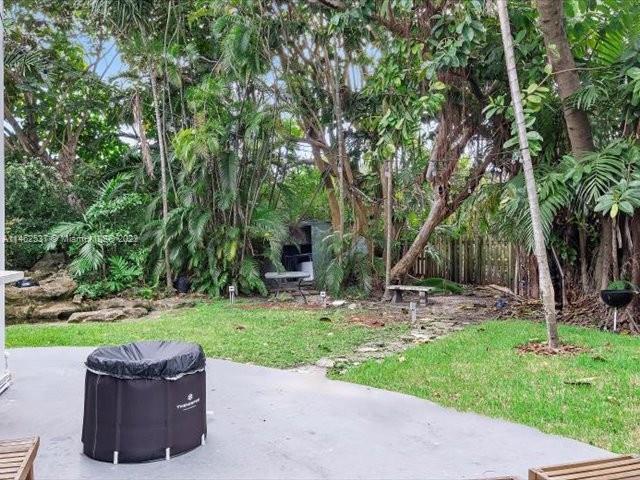 600 Surfside Boulevard Surfside, FL 33154 - Photo 11 of 31 a wooden bench sitting in the middle of a park