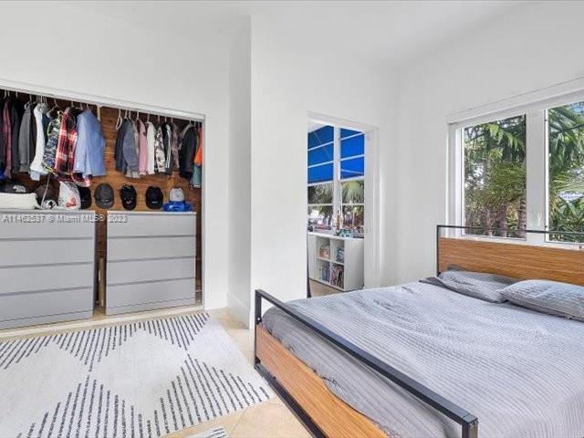 600 Surfside Boulevard Surfside, FL 33154 - Photo 16 of 31 a bedroom with a bed and a dresser