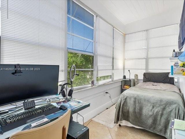 600 Surfside Boulevard Surfside, FL 33154 - Photo 18 of 31 a bedroom with a bed and a window