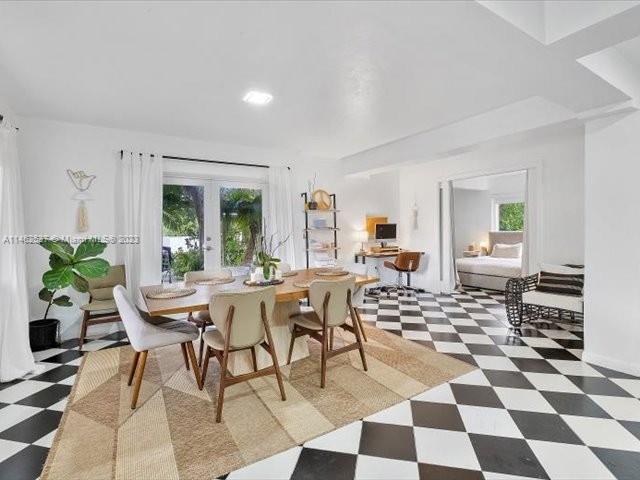 600 Surfside Boulevard Surfside, FL 33154 - Photo 26 of 31 a dining room with a black white checkered floor with a black white checkered floor