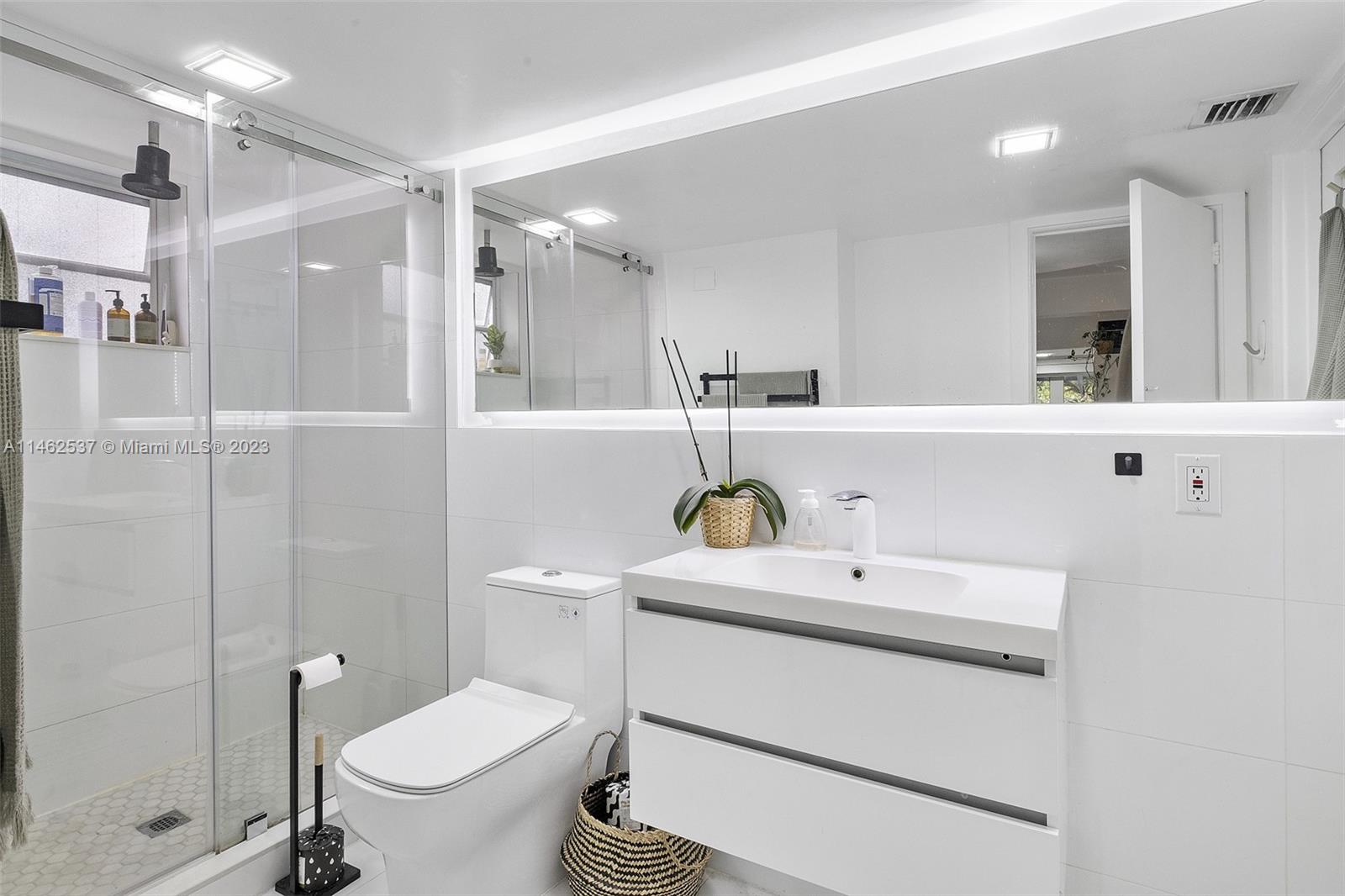 600 Surfside Boulevard Surfside, FL 33154 - Photo 27 of 31 a bathroom with a sink toilet and shower