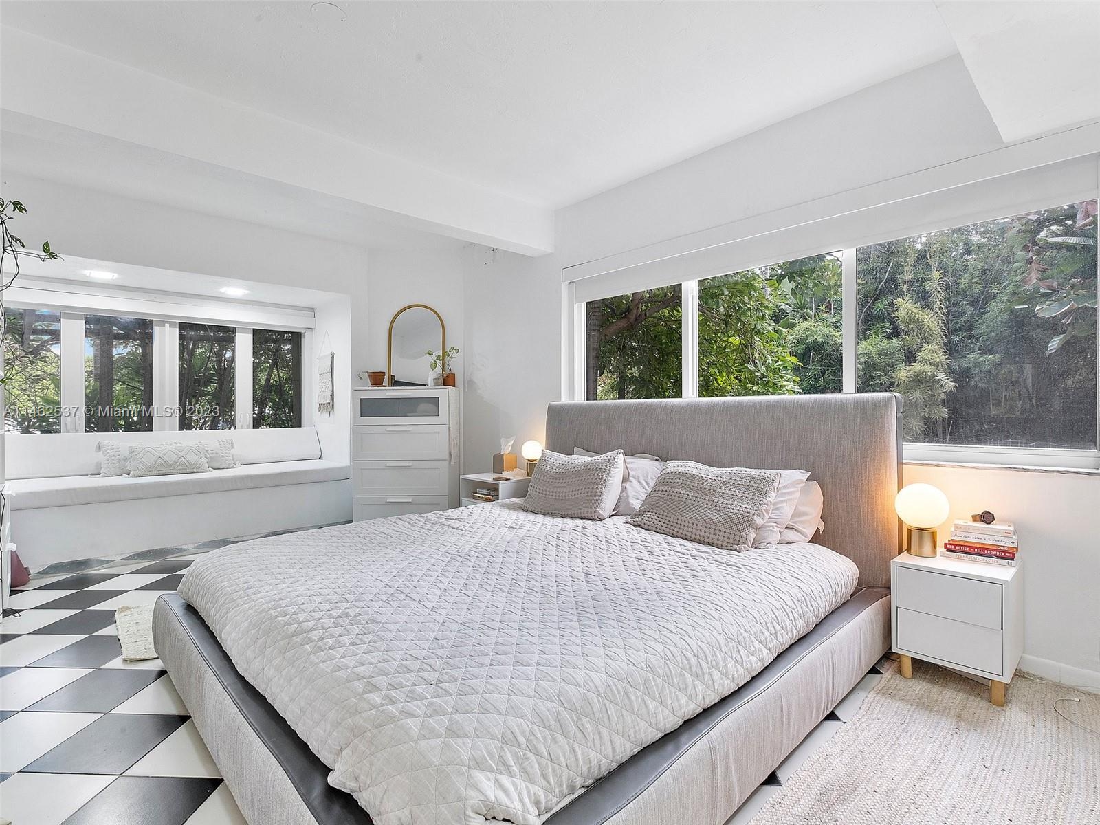 600 Surfside Boulevard Surfside, FL 33154 - Photo 31 of 31 a bedroom with a large bed and a large window