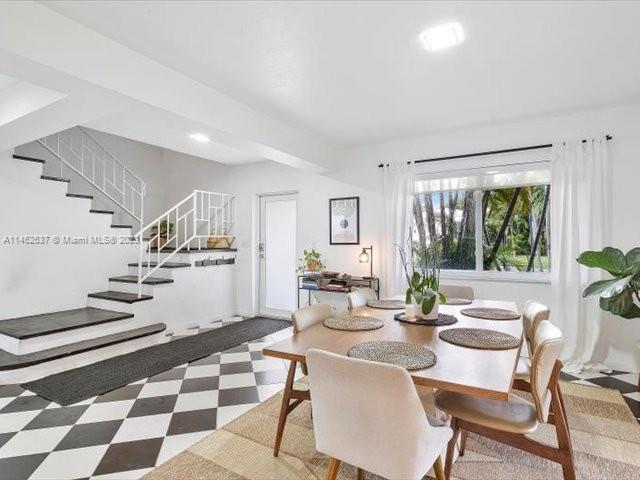 600 Surfside Boulevard Surfside, FL 33154 - Photo 6 of 31 a view of a dining room with furniture a rug and wooden floor