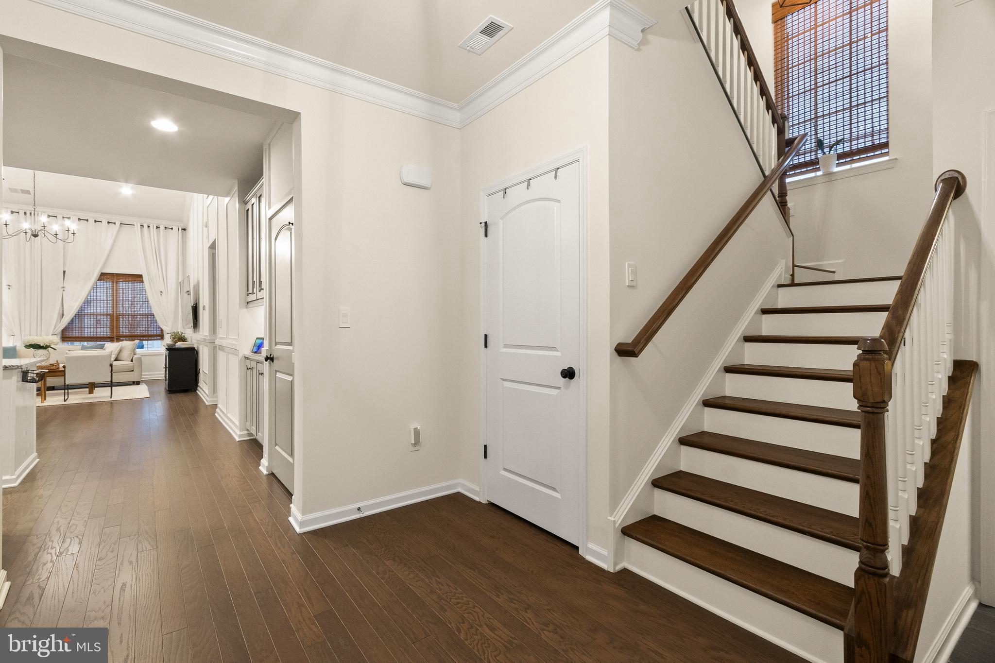 407 Sun Boulevard Bear, DE 19701 - Photo 11 of 69 a view of entryway with wooden floor and stairs