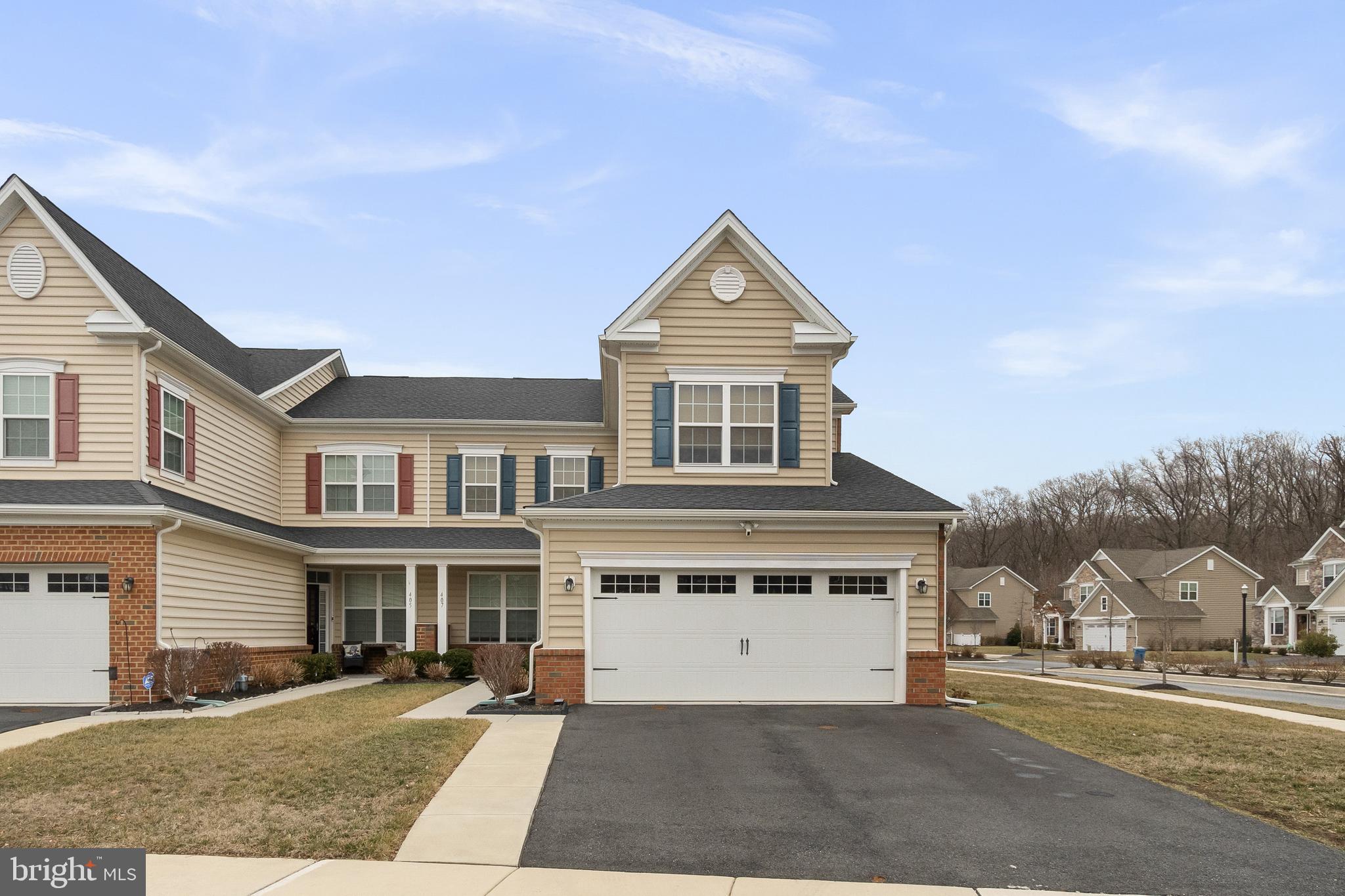 407 Sun Boulevard Bear, DE 19701 - Photo 2 of 69 a front view of a house with a yard and garage