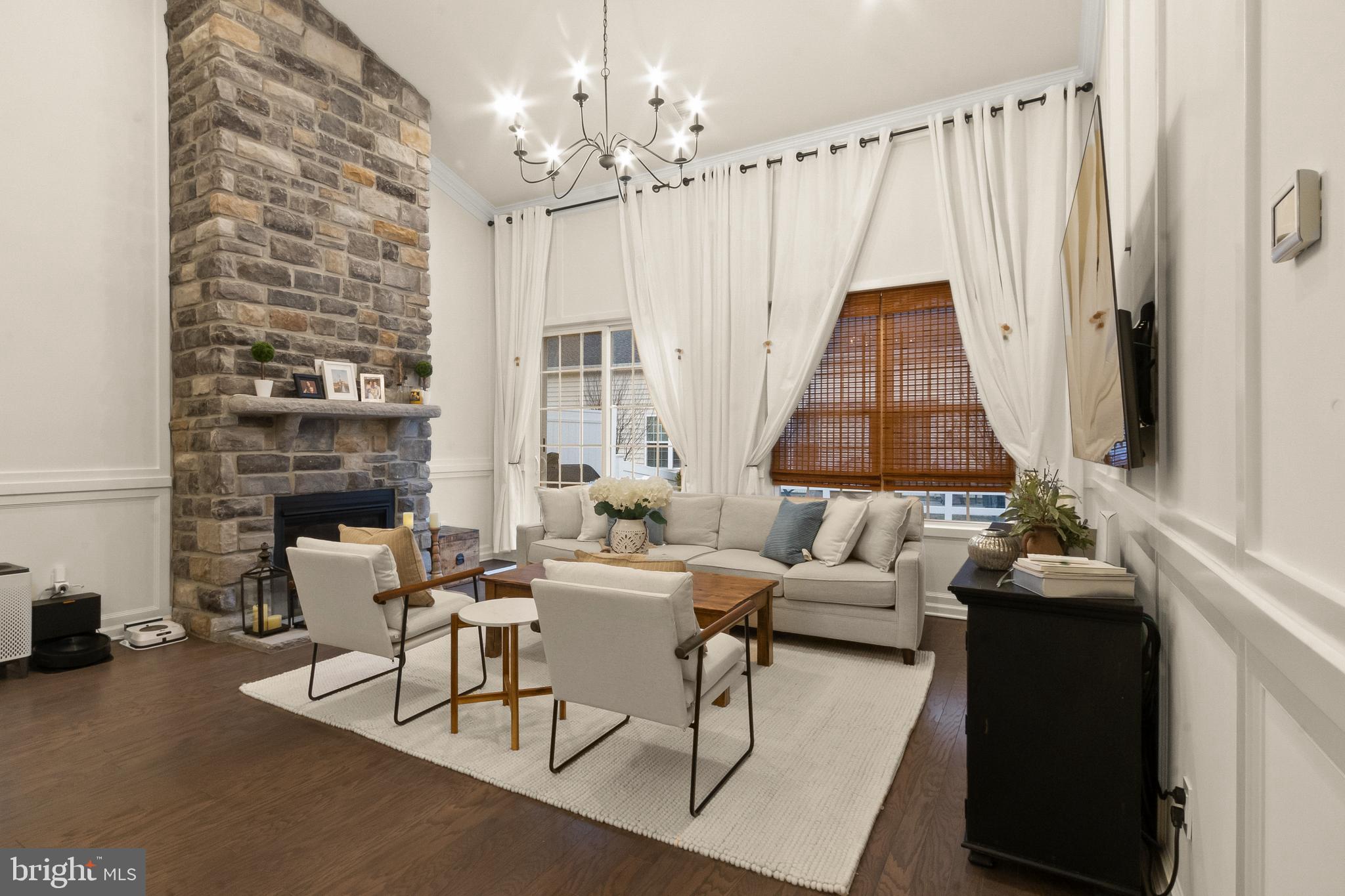 407 Sun Boulevard Bear, DE 19701 - Photo 25 of 69 a living room with furniture and a chandelier