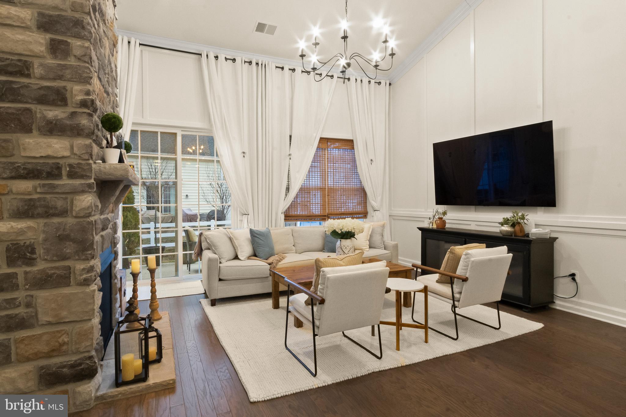 407 Sun Boulevard Bear, DE 19701 - Photo 26 of 69 a living room with furniture and a flat screen tv