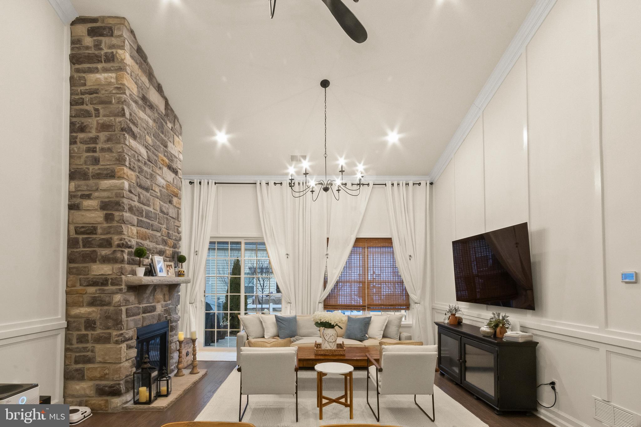407 Sun Boulevard Bear, DE 19701 - Photo 27 of 69 a living room with fireplace furniture and a flat screen tv
