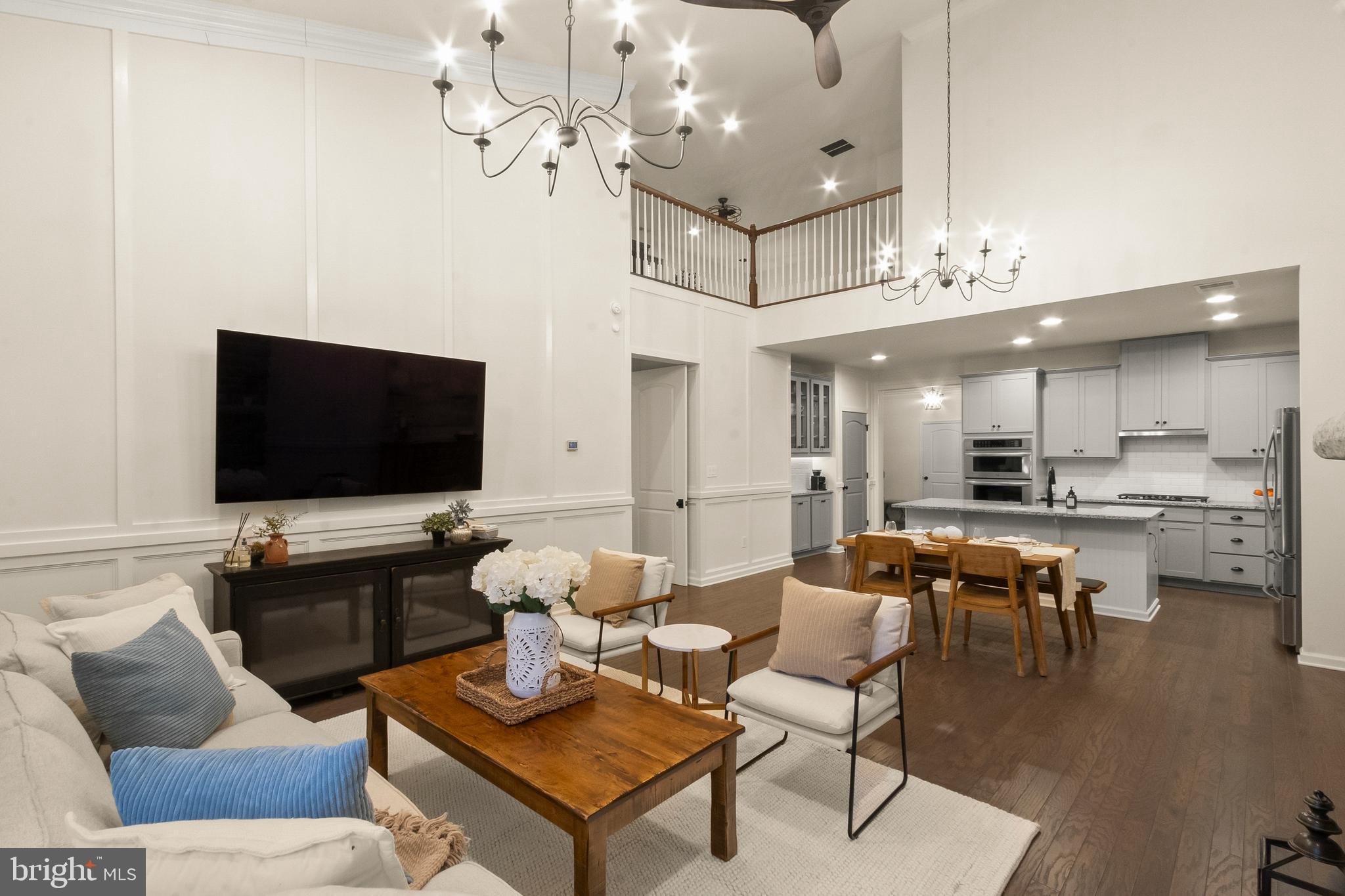 407 Sun Boulevard Bear, DE 19701 - Photo 29 of 69 a living room with furniture kitchen view and a flat screen tv