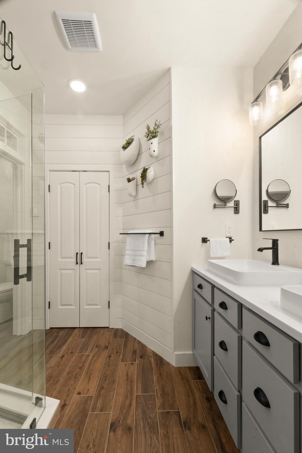 407 Sun Boulevard Bear, DE 19701 - Photo 37 of 69 a spacious bathroom with a granite countertop sink a mirror and shower