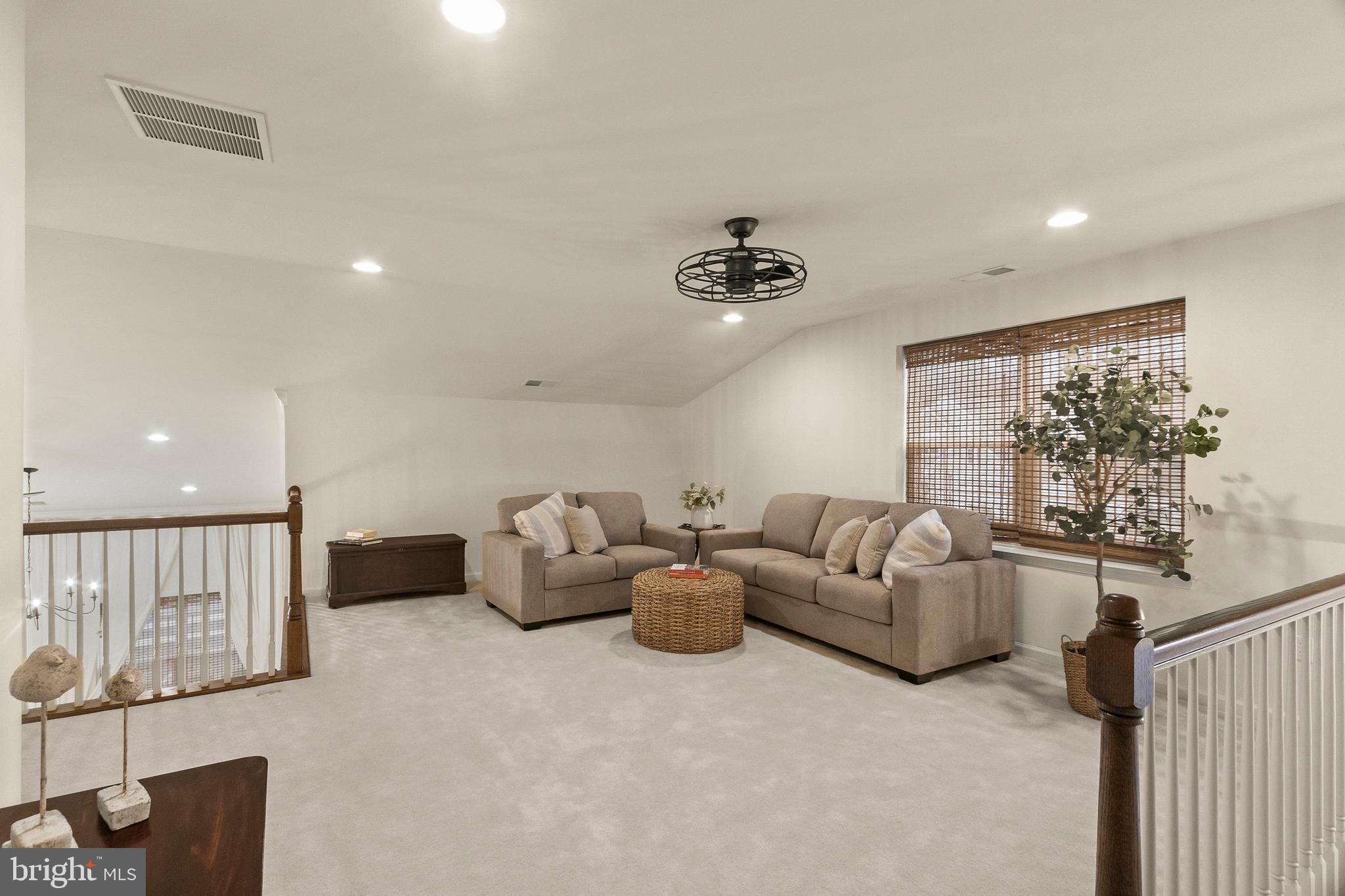 407 Sun Boulevard Bear, DE 19701 - Photo 44 of 69 a living room with furniture and a flat screen tv