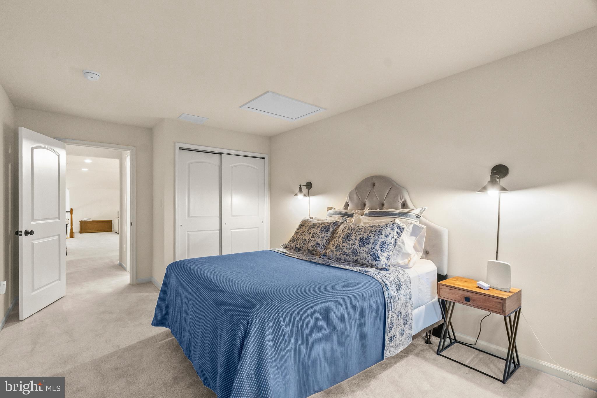 407 Sun Boulevard Bear, DE 19701 - Photo 54 of 69 a bedroom with a bed and chair