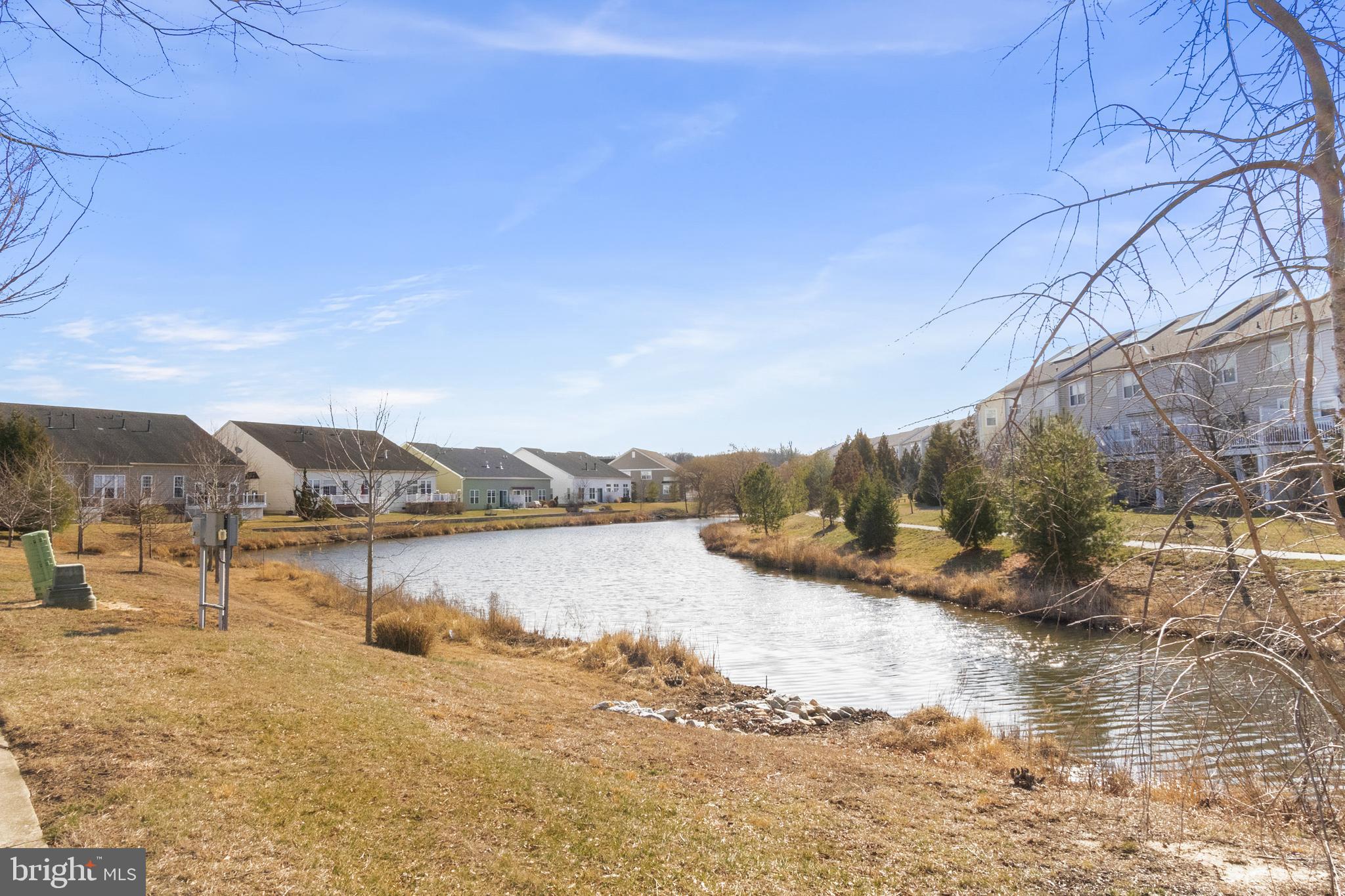 407 Sun Boulevard Bear, DE 19701 - Photo 64 of 69 a view of a lake with a mountain in the background