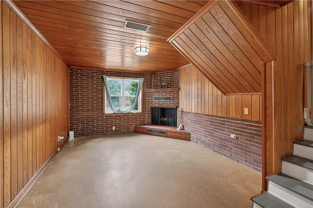 1601 Walnut Avenue Brunswick, GA 31520 - Photo 8 of 26 First floor bonus room with fireplace
