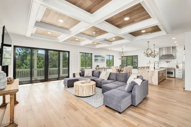 a bedroom with a bed and a flat tv screen on dresser