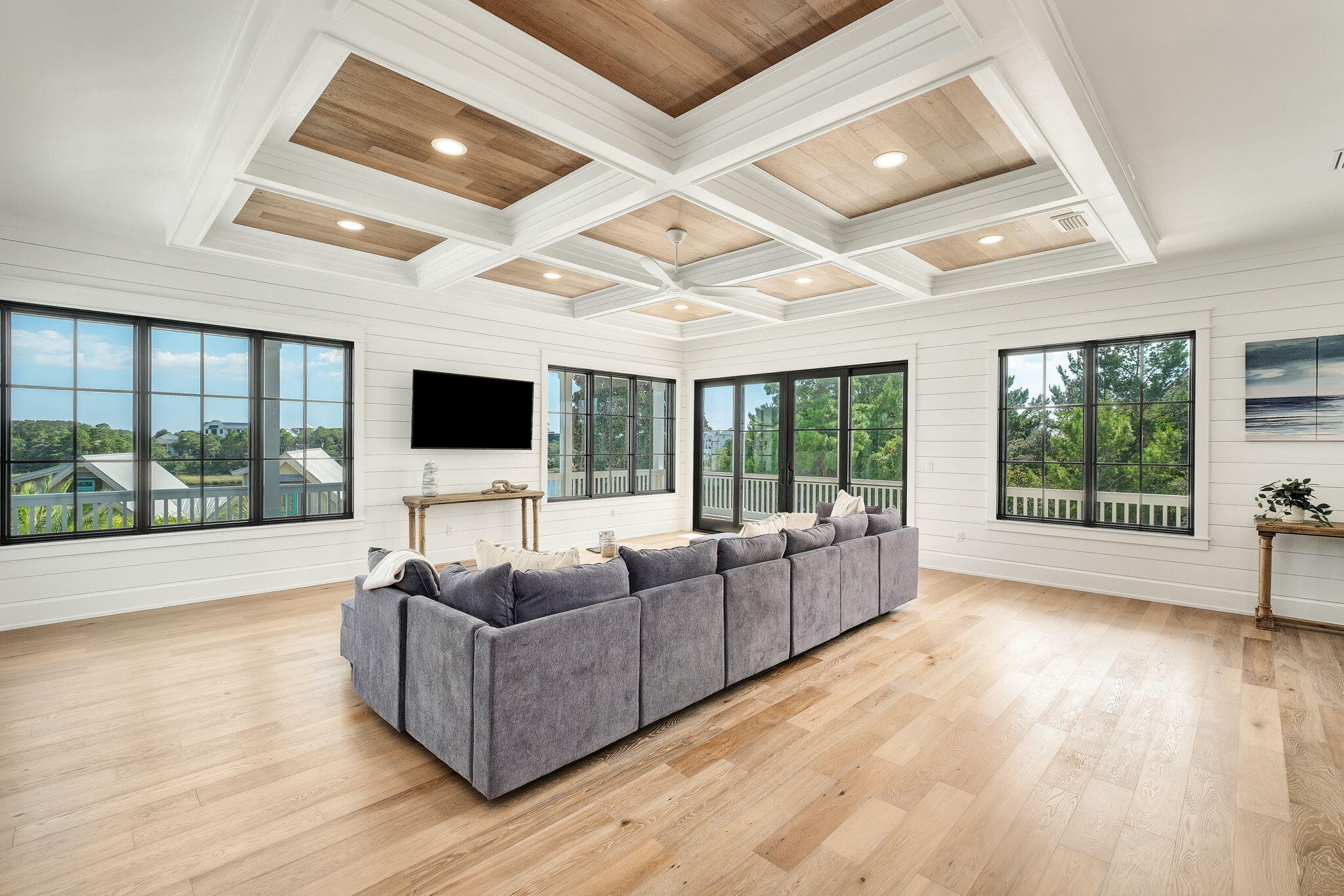7570 East County Highway 30A Watersound, FL 32461 - Photo 25 of 64 a living room with furniture flat screen tv and a large window