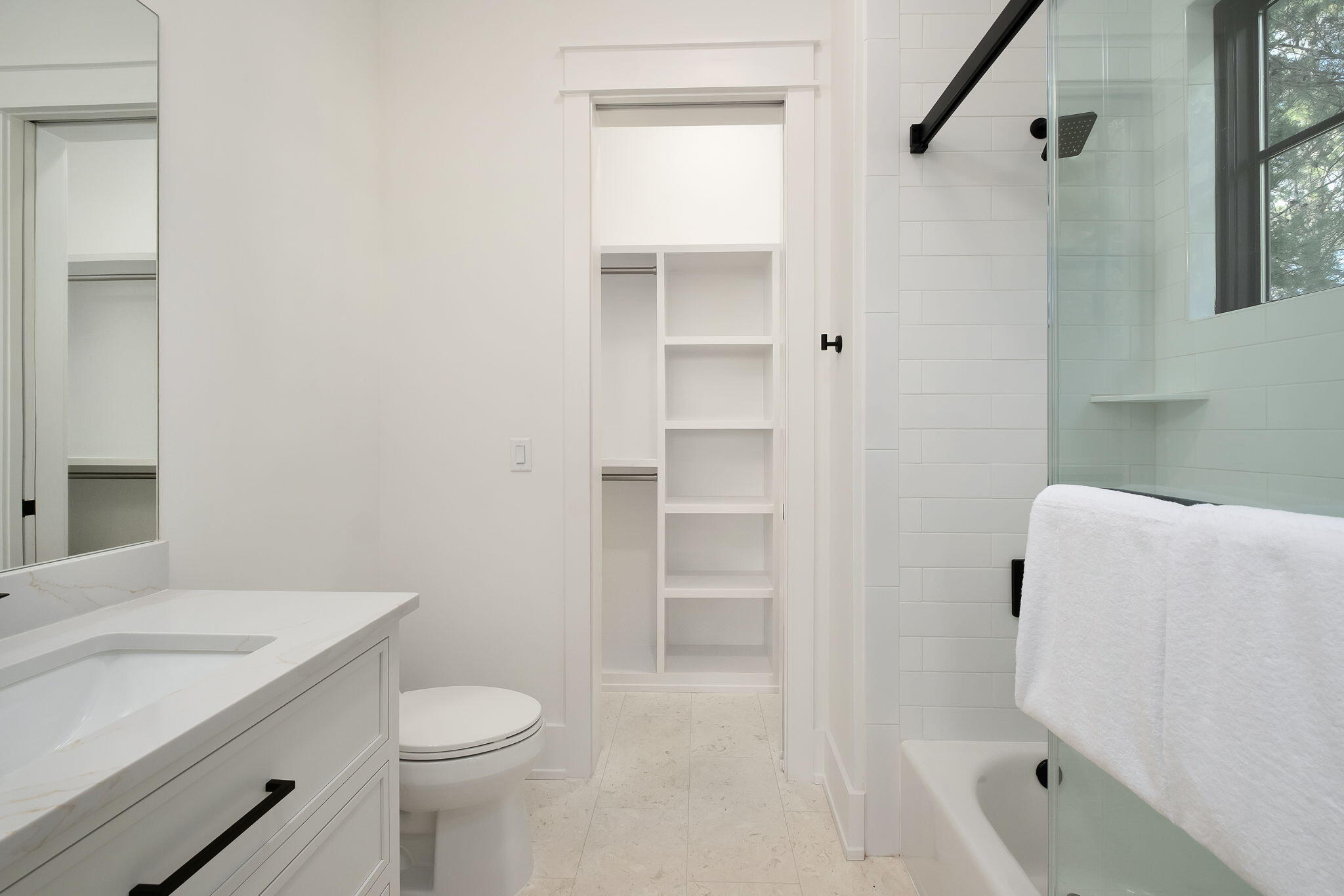 7570 East County Highway 30A Watersound, FL 32461 - Photo 34 of 64 a bathroom with a sink a toilet and shower