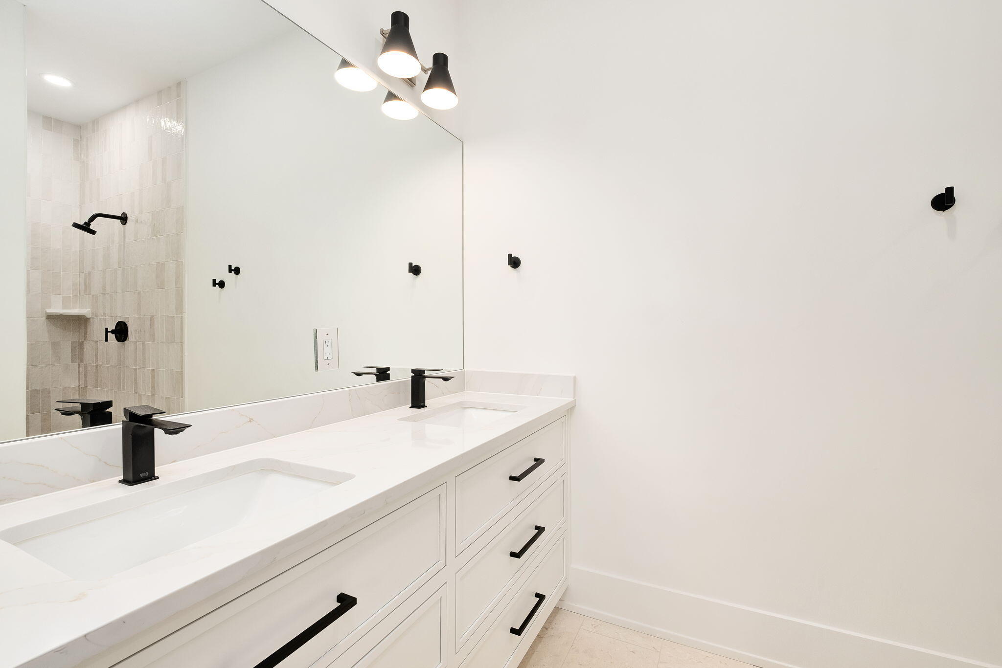 7570 East County Highway 30A Watersound, FL 32461 - Photo 37 of 64 a bathroom with a sink and a mirror