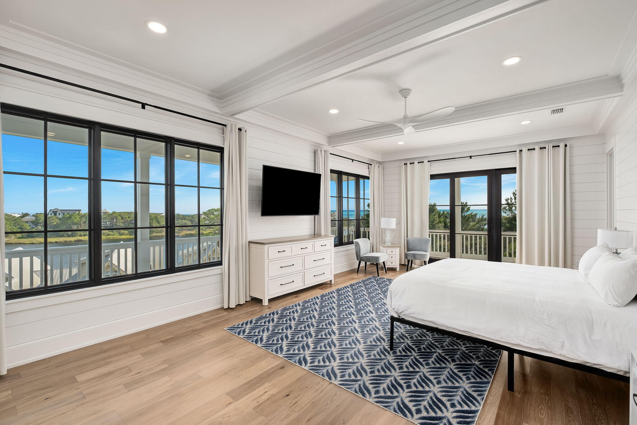 7570 East County Highway 30A Watersound, FL 32461 - Photo 38 of 64 a living room with furniture and a flat screen tv