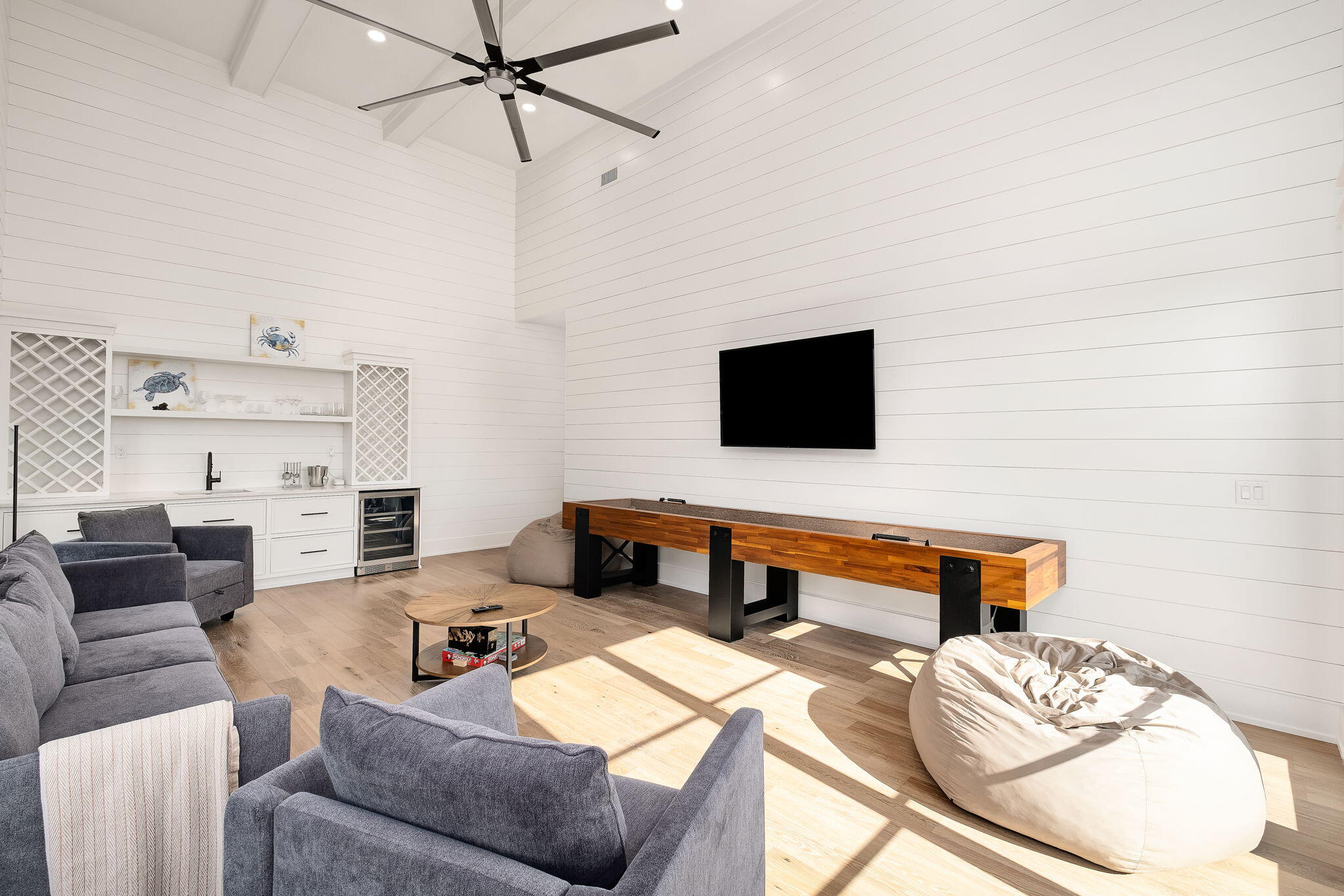 7570 East County Highway 30A Watersound, FL 32461 - Photo 46 of 64 a living room with furniture and a flat screen tv