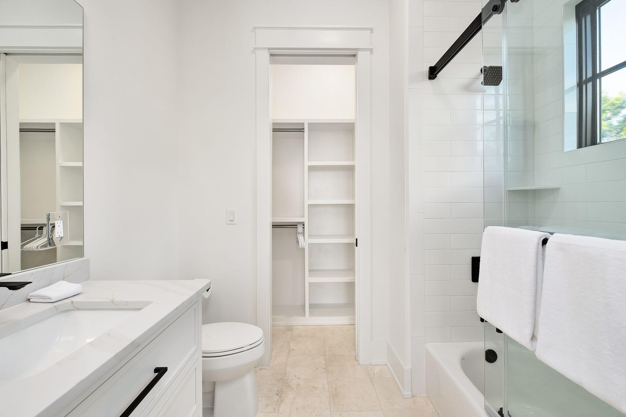 7570 East County Highway 30A Watersound, FL 32461 - Photo 52 of 64 a bathroom with a sink toilet and shower