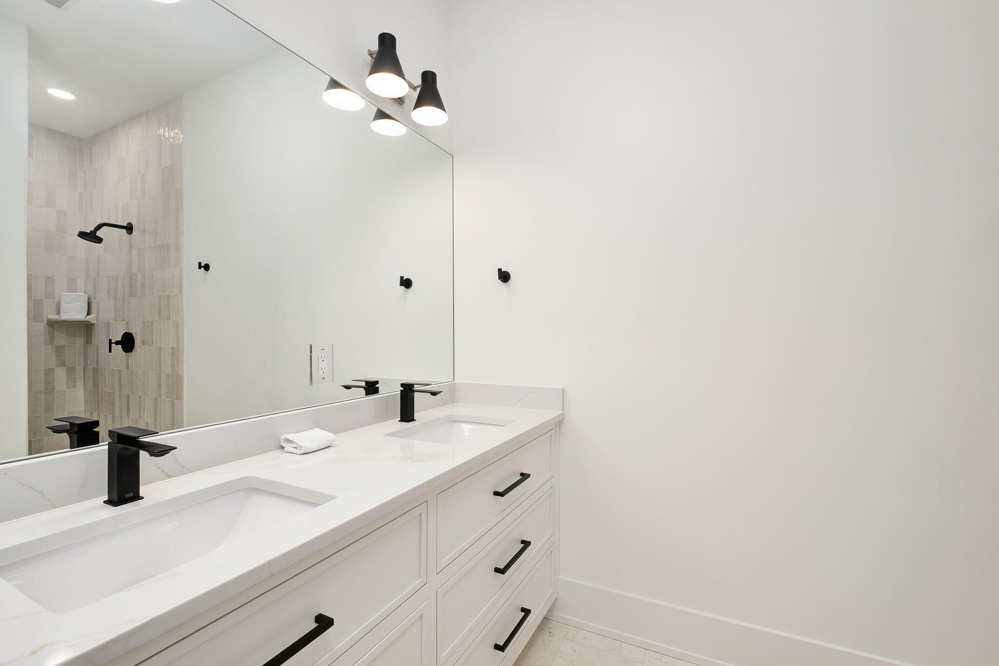 7570 East County Highway 30A Watersound, FL 32461 - Photo 54 of 64 a bathroom with a sink vanity and a mirror
