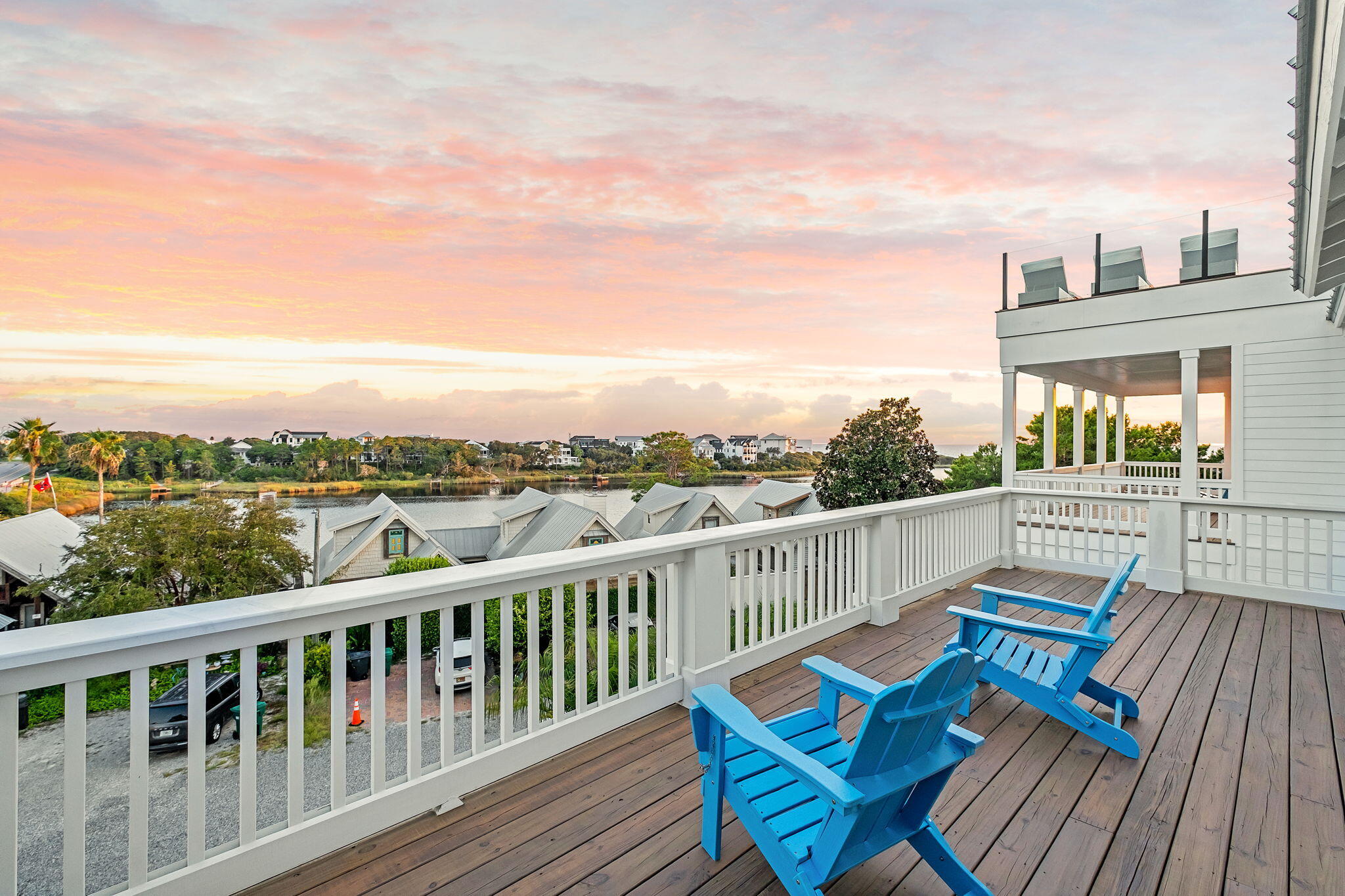 7570 East County Highway 30A Watersound, FL 32461 - Photo 64 of 64 a view of a balcony with wooden chairs