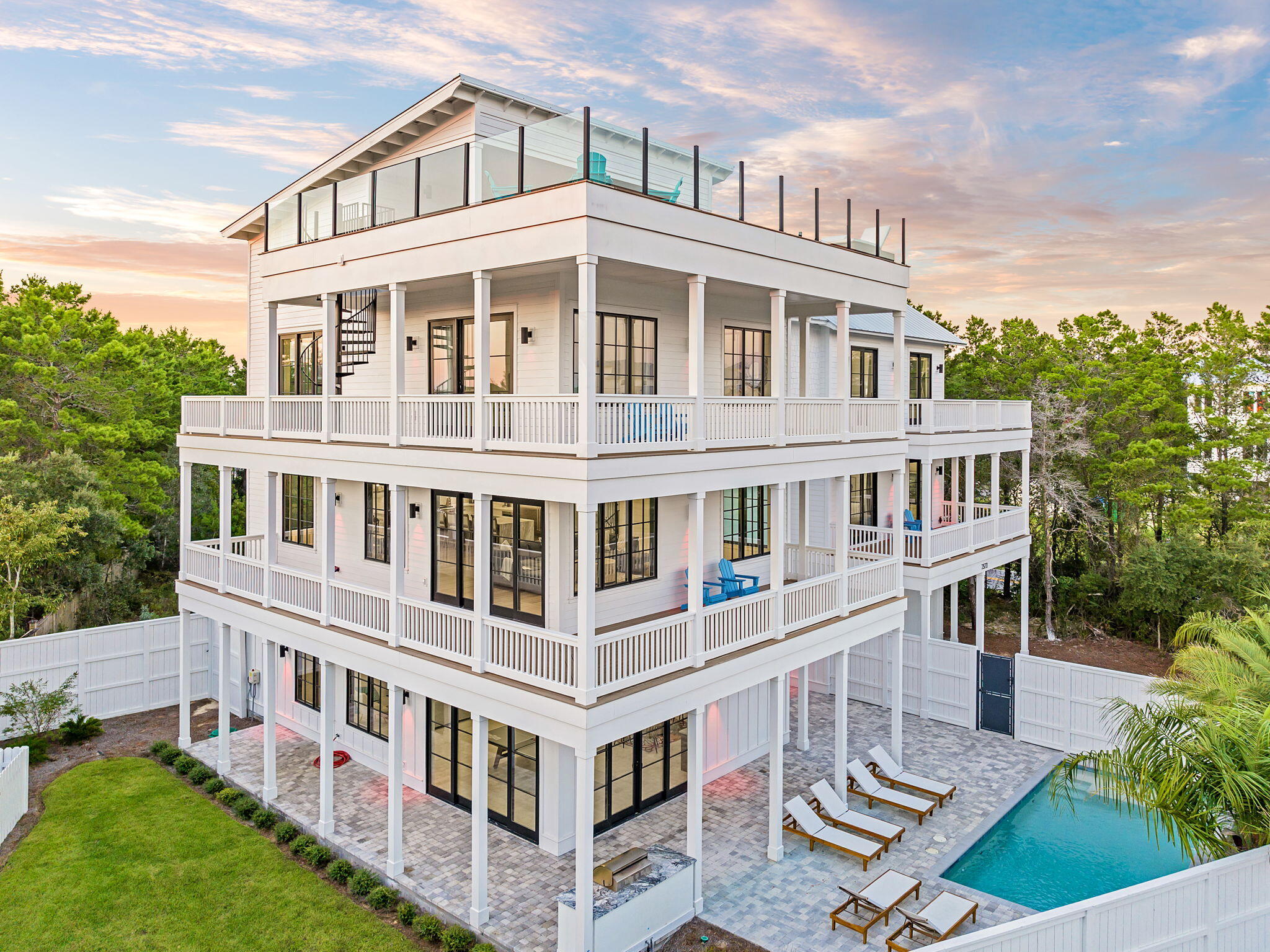 7570 East County Highway 30A Watersound, FL 32461 - Photo 7 of 64 a view of a building in the middle of a yard
