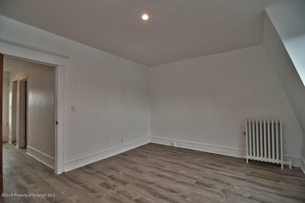1324 Linden Street Scranton, PA 18510 - Photo 24 of 28 an empty room with wooden floor and windows