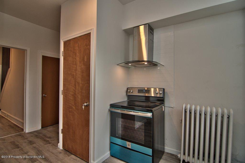 1324 Linden Street Scranton, PA 18510 - Photo 28 of 28 a kitchen with a stove and a microwave
