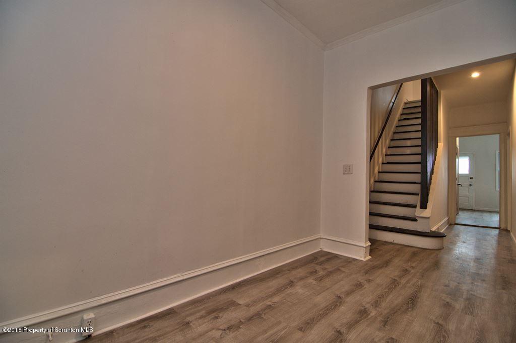 1324 Linden Street Scranton, PA 18510 - Photo 3 of 28 a view of a room with wooden floors and stairs