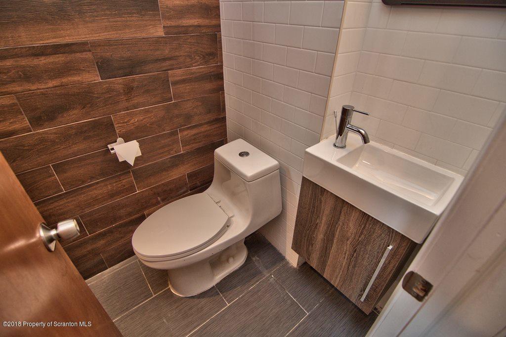 1324 Linden Street Scranton, PA 18510 - Photo 6 of 28 a bathroom with a toilet and a sink