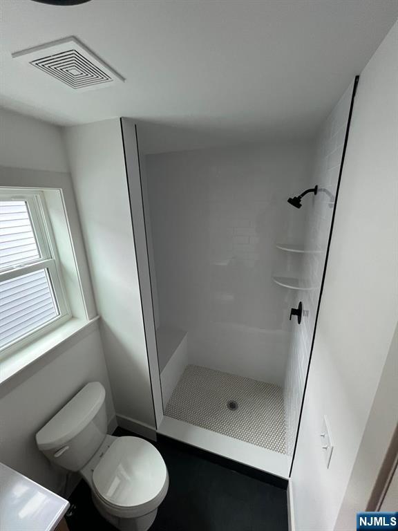 1060 Magnolia Avenue Elizabeth, NJ 07201 - Photo 17 of 22 a bathroom with a toilet and a shower