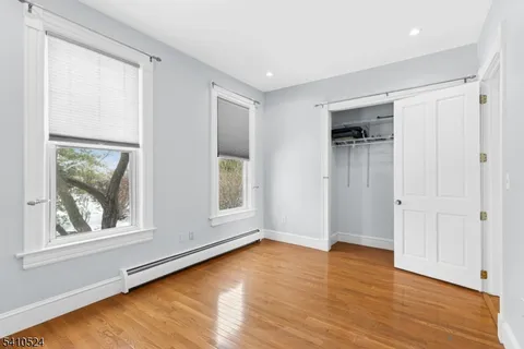 a bathroom with a granite countertop sink a shower and a mirror