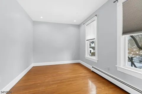 a view of an empty room with a tv