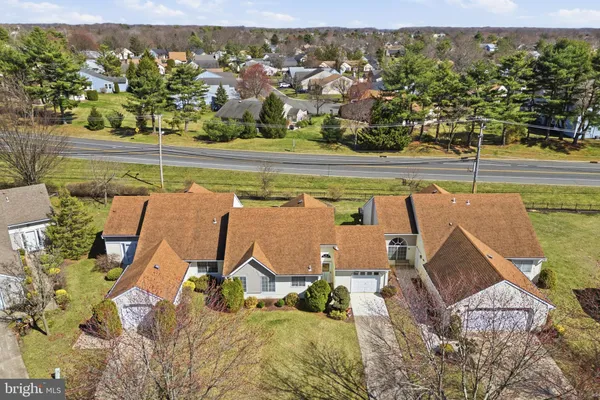 an aerial view of a house with a lake view
